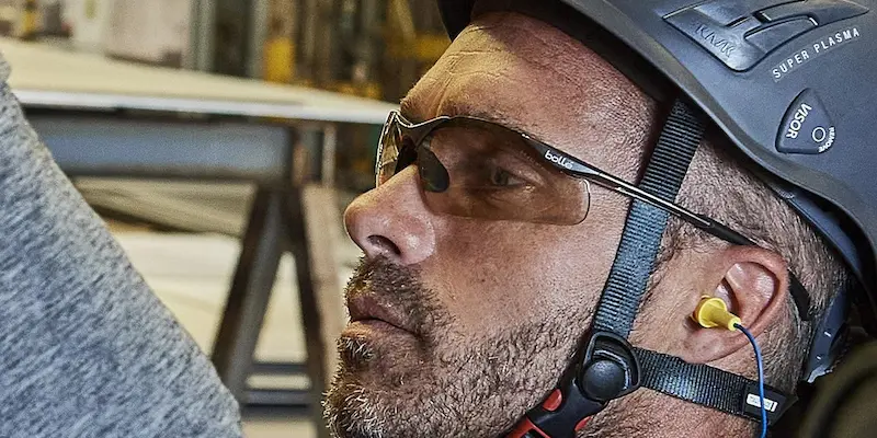 Male wearing safety glasses and helmet